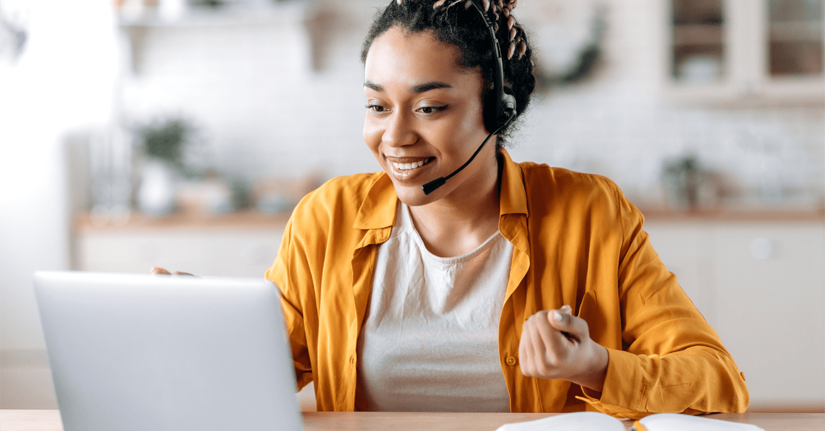 Happy person working with a headset