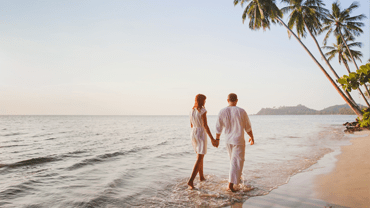 Couple walking along a beach