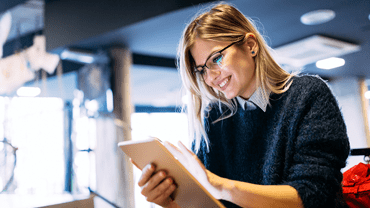 Happy woman working on a laptop