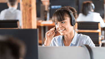 Happy woman working in a call centre